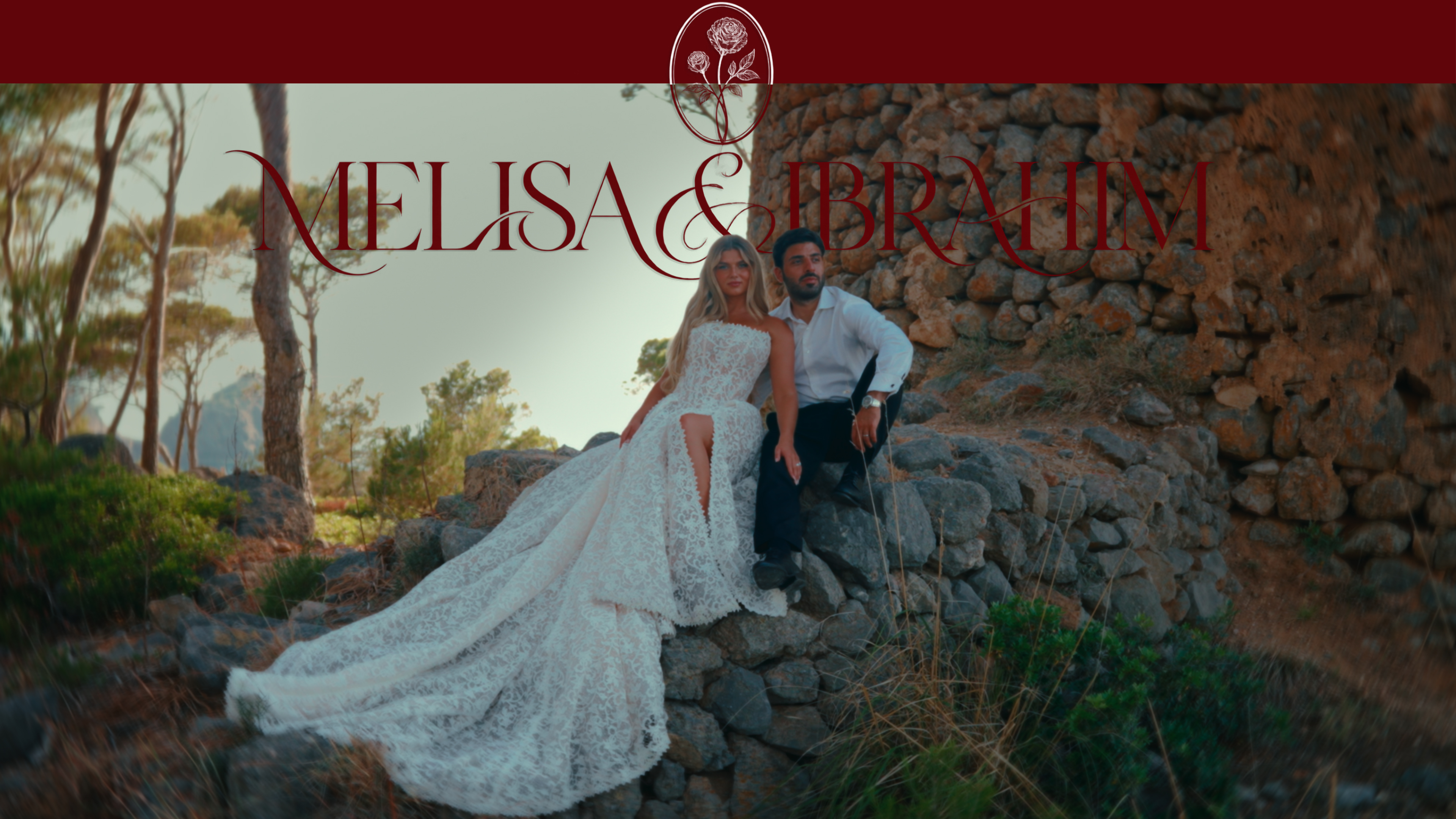 Melisa and Ibrahim seated together in Mallorca, beneath their name and rose emblem